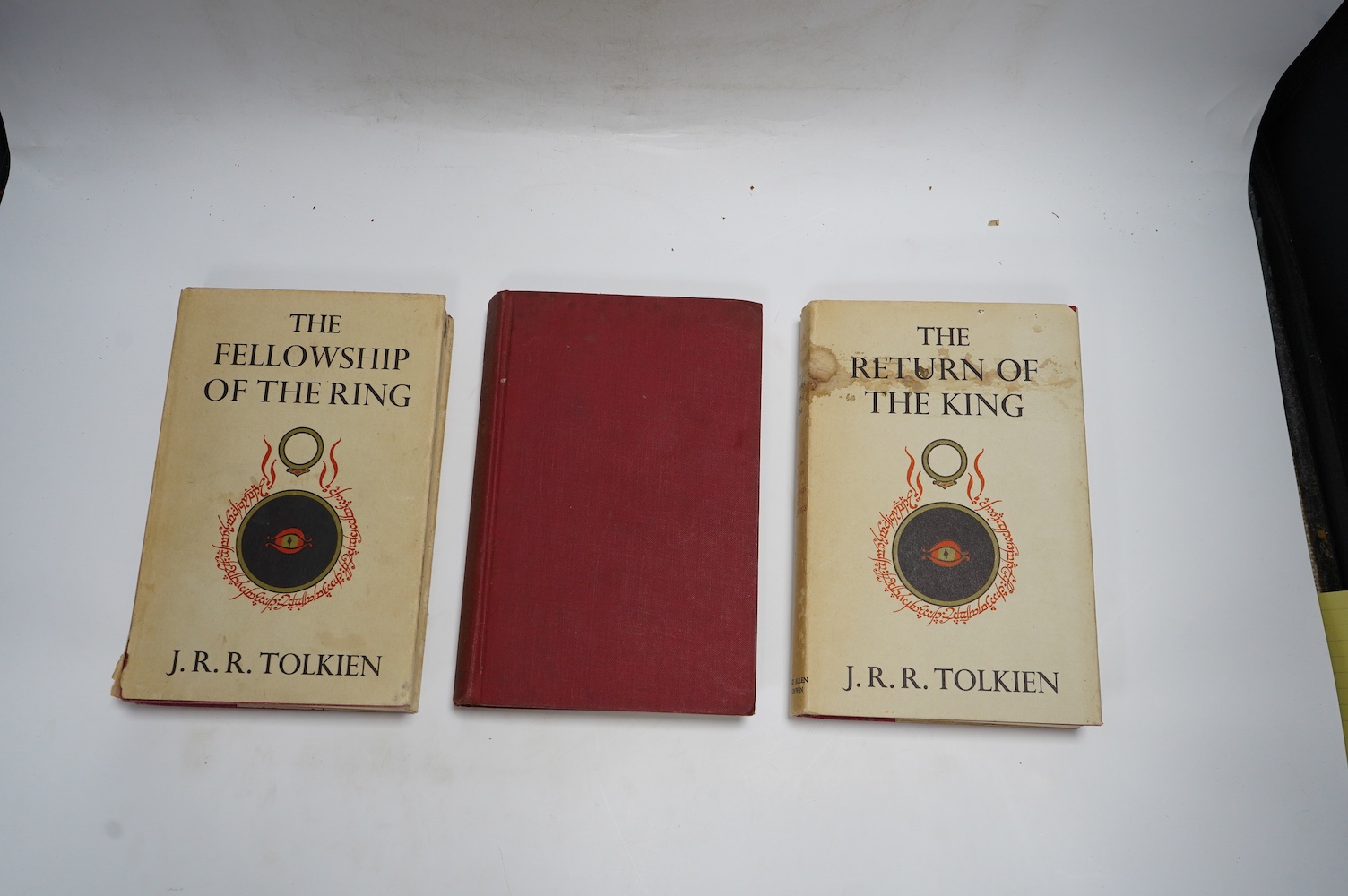 Tolkien, J.J.R - Lord of the Rings, 3 vols, to consist of The Fellowship of the Rings, first edition, 14th. impression, original cloth, folding map at rear, unclipped dust-jacket, with browned spine and closed tear to 4c